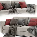 Light Gray Sofa With Red Gray Striped Pillows And Textured Blankets 3d model