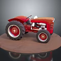 Red Vintage Tractor Model Featuring Large Wheels On Brown Display Base 3d model