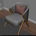 Gray Accent Chair With Wooden Legs And Pink Cushion In Bright Sunlit Room