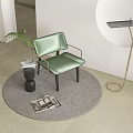 Green Accent Chair With Metal Armrests Side Table Potted Plant Floor Lamp Round Decorative Wall Gray Rug