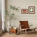 Cozy Brown Lounge Chair by Window with Green Plants and Two Paintings on Wall