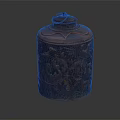 Brown Decorative Storage Jar With Carved Animal Patterns And Ring Shaped Lid