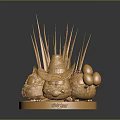 Golden Sculpture Featuring Straw Hat Top Decorative Spikes And Golden Spheres On Base