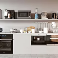 Organized Kitchen Countertop With Coffee Maker Microwave Blender Kettle Pots Bowls And Cooking Utensils