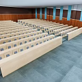 Conference Room Interior With Rows of Seats Wooden Walls Blue Stripes and Gray Floor Tiles