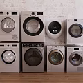 Modern Front Loading Washing Machines Displayed Against Brick Wall Wooden Floor