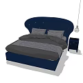 Navy Blue Double Bed With Curved Upholstered Headboard And Gray Bed Linens