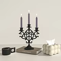 Elegant Black Candelabra With Three Purple Candles On Book And White Spherical Tissue Box