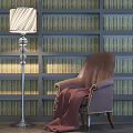 Comfortable Brown Leather Accent Chair with Red Blanket Against Bookshelf Wall and Vintage Floor Lamp