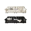 Modern Cream Leather Two Seater Sofa With Black White Patterned And Striped Decorative Pillows
