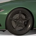 Green Convertible Sports Car With Sleek Design White Circular Decals And Black Wheels