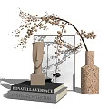 Modern Vase With Speckled Texture Holding Slender Beige Blossom Branches On Books