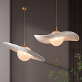 Two Modern Pendant Lights With Spherical Shade Gold Chain And Wavy Ring Decoration On Gray Wall