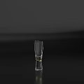 Transparent Shot Glass Placed On Black Surface With Gray Background Minimalist Style