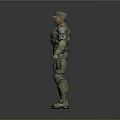 Man in Military Camouflage Uniform with Tactical Gear Standing Against Gray Background