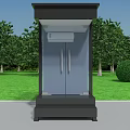 Black Glass Security Booth on Green Lawn with Trees and Bushes by Roadside
