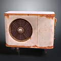 Vintage Rusted Metal Equipment With Circular Fan Grille And Aged Surface