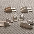 Cozy Beige And White Home Slippers On Light Carpet For Comfortable Wear