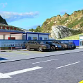Road Facilities At Mountain Tunnel Entrance With Yellow Barriers And Double Yellow Lines