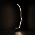 Modern Floor Lamp With Face Profile Shape Illuminated Line In Dark Background 3d model