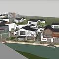 Traditional Modern Riverside Commercial Street With White Buildings Shops Greenery And Mountain Views
