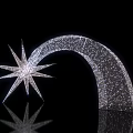 Sparkling Silver Art Installation Featuring Star Shape And Curved Arch With Reflection