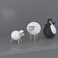 Cute White Toy Sheep And Black Penguin Figurines On Grey Platform