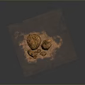 Multiple Natural Orange Textured Stone Materials Placed On Earthy Sandy Ground