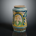 Colorful Decorative Jar With Blue Yellow White Patterns And Portrait Figure