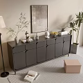 Black Modern Chest of Drawers in Living Area with Floor Lamp Potted Plant and Wall Art