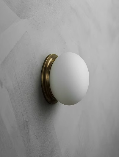 Minimalist White Globe Wall Lamp With Brass Base On Gray Textured Wall 3d model