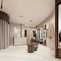 Bright Modern Light Luxury Clothing Store Interior With Elegant Garment Display And Marble Reception Counter