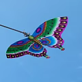 Colorful Butterfly Ornament With Vibrant Green Blue Pink Purple Patterned Wings And Hanging Loop