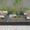 Outdoor Sofa with Rattan Chairs Coffee Tables Green Plants and Pink Flowers on Wooden Floor