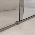 Modern Textured Stainless Steel Door Handle Mounted On Glass Door With Marble Wall Interior