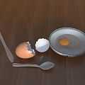 Cracked Egg With Yolk On Ceramic Plate And Kitchen Utensils On Wooden Table