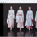 Women Walking in Elegant Traditional Clothing on a Fashion Show Runway