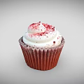 Delicious Cupcake With Red Paper Cup And White Cream Frosting Topped With Red Sprinkles