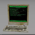 Vintage Electronic Computer With Worn Monitor Keyboard And Green Screen Text