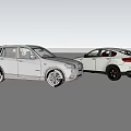 Two White And Silver Cars Parked In Open Field With Blue Sky And Clouds
