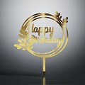 Golden Circular Cake Topper With Happy Birthday Text And Decorative Leaves