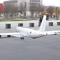 White Airliner with Wing Mounted Engines and Fuselage Logo Parked at Glass Walled Building