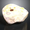 Natural Speckled Stone With Yellow Brown White Tones And Textured Surface