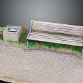 Park Rest Area With Wooden Bench Stone Trash Can Brick Pavement And Green Grass