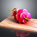 Fresh Pink Dragon Fruit on Wooden Cutting Board with Black Background