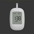 White Digital Glucose Meter With Blood Glucose Reading And Test Strip On Gray Background
