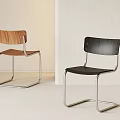Modern Dining Chairs With Wooden And Black Seats And Metal Frame Design