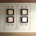 Four Black Framed Abstract Paintings With Colorful Marbled Textures On Light Wall