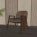 Leather Leisure Chair with Throw Blanket in Cozy Room near Wooden Wall and Green Plant