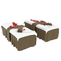 Two Comfortable Massage Beds With White Brown Covers Red Petals And Towels